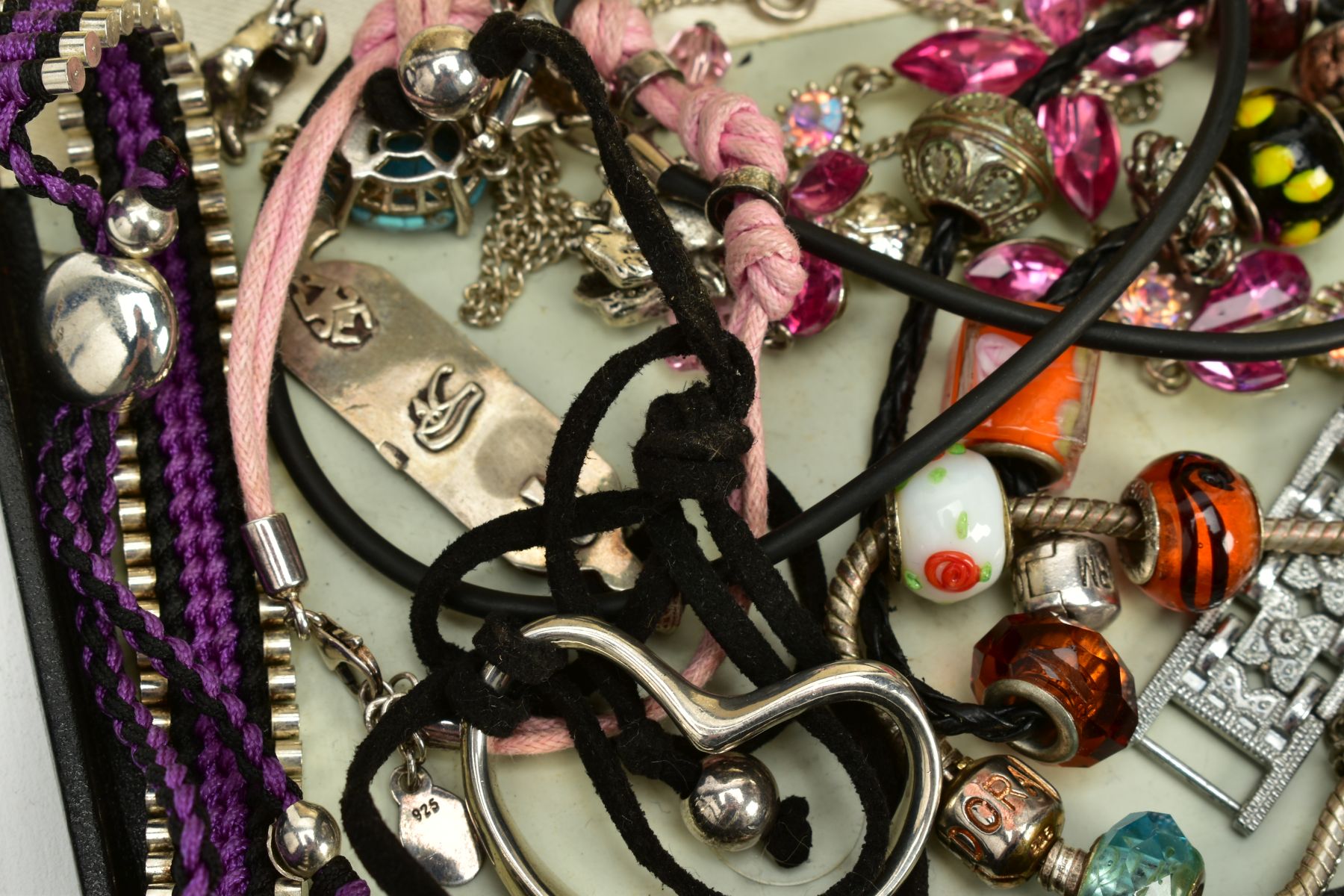 A SELECTION OF COSTUME JEWELLERY, to include two white metal charm bracelets with charms, a pink - Image 3 of 3