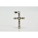 A WHITE METAL DIAMOND SET CROSS PENDANT, designed with eleven claw set round brilliant cut diamonds,