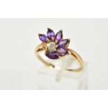 A 9CT GOLD AMETHYST AND DIAMOND RING, of a spray design set with six marquise cut amethyst stones,