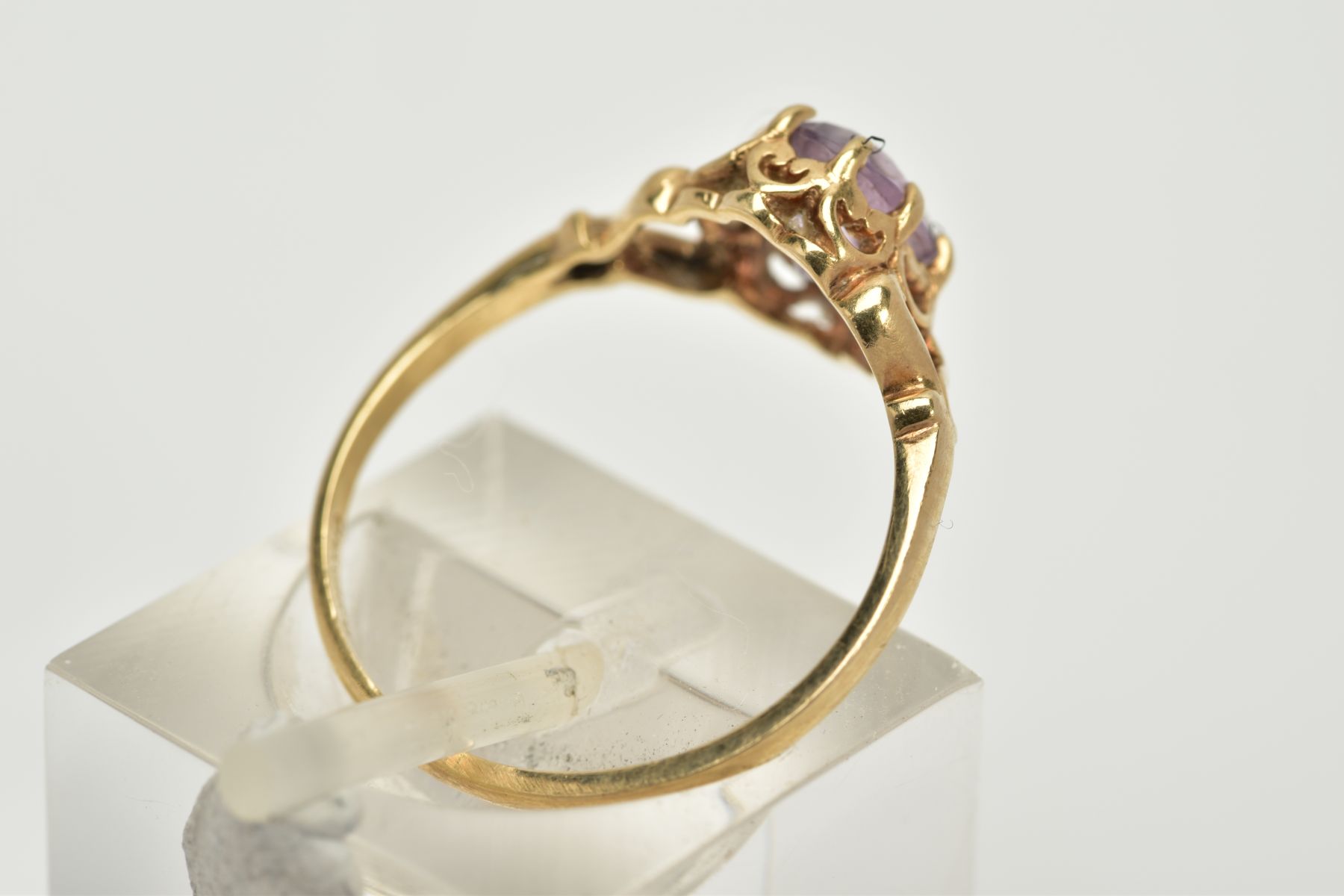 A 9CT GOLD AMETHYST RING, designed with a claw set, oval cut amethyst within an open work gallery, - Image 3 of 3