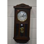 AN EARLY TO MID 20TH OAK CENTURY WALL CLOCK (pendulum and key)