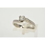 A PLATINUM SINGLE STONE DIAMOND RING, of crossover design, with a claw set round brilliant cut