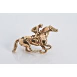 A 9CT GOLD JOCKEY BROOCH, hallmarked 9ct gold London 1989, makers mark H G, length 34.9mm,