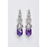 A PAIR OF WHITE METAL, DIAMOND AND AMETHYST DROP EARRINGS, each designed with a round brilliant