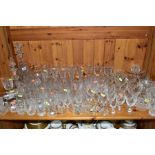 A QUANTITY OF CUT GLASSWARES, etc, to include two decanters, various glasses (wines, tumblers,