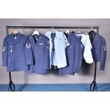 SIX ITEMS OF U.S. AIR FORCE UNIFORMS, as follows, four dress jackets, some with rank stripes, one