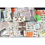 LARGE COLLECTION OF STAMPS IN TWO BOXES, housed in four albums and loose album, pages/covers