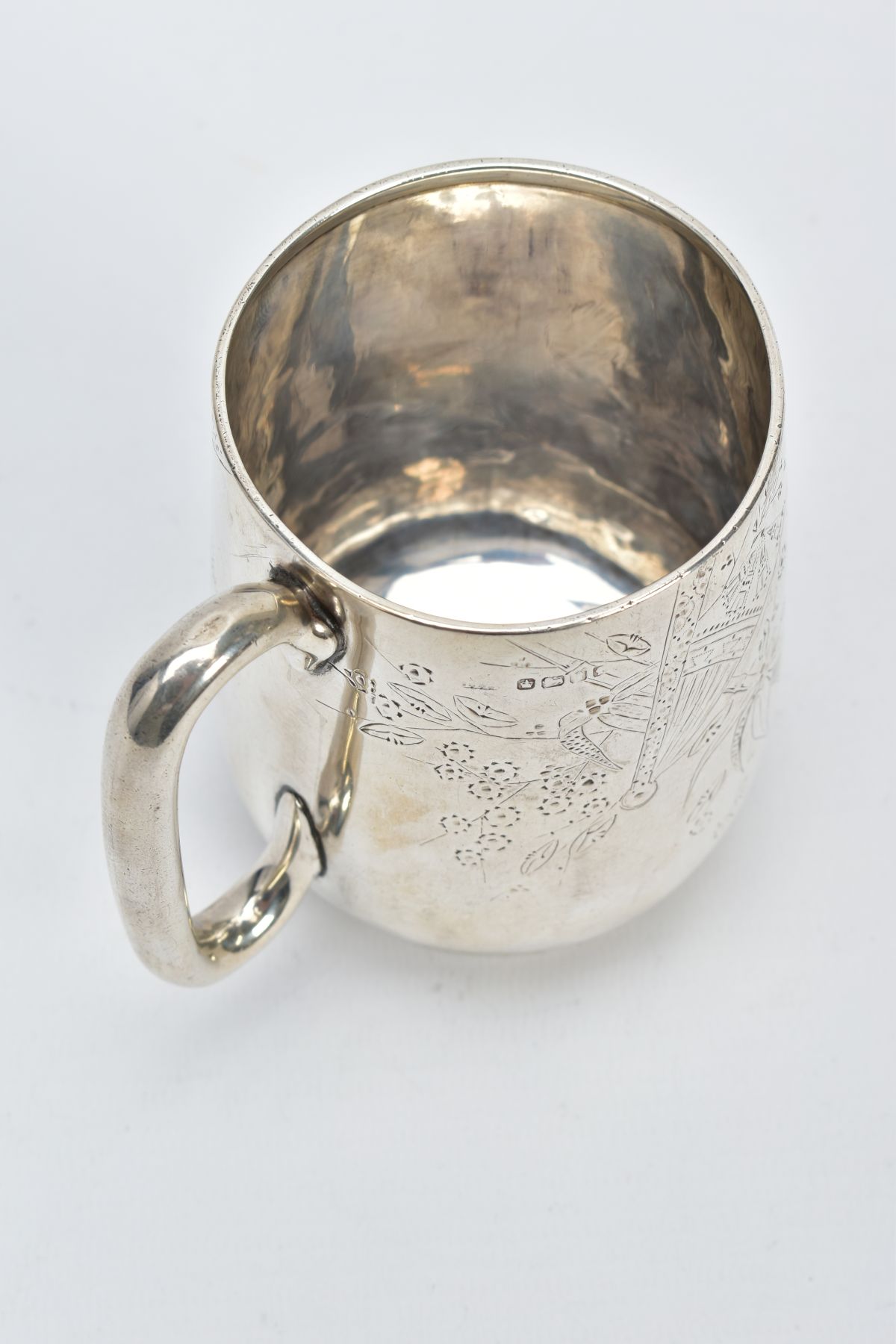 A VICTORIAN SILVER MUG, with a floral and foliate engraved design body, plain polished handle, on - Image 4 of 5