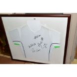A FRAMED LOTTO TENNIS SHIRT, autographed by Pat Cash, Peter Flemming, Andrew Castle and Ilie