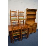 A STAINED PINE KITCHEN TABLE, 120cm x depth 79cm x height 75cm, four chairs together with a pine