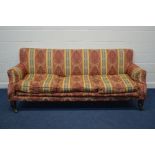 A VICTORIAN RED, GOLD, STRIPPED AND FOLIATE UPHOLSTERED THREE SEATER SOFA, on large front