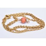A YELLOW METAL CHAIN AND A CORAL BEAD CLASP, the trace link chain, fitted with a spring clasp,