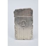 AN EARLY VICTORIAN SILVER CARD CASE, of a rectangular wavy form, with a foliate and engine turn