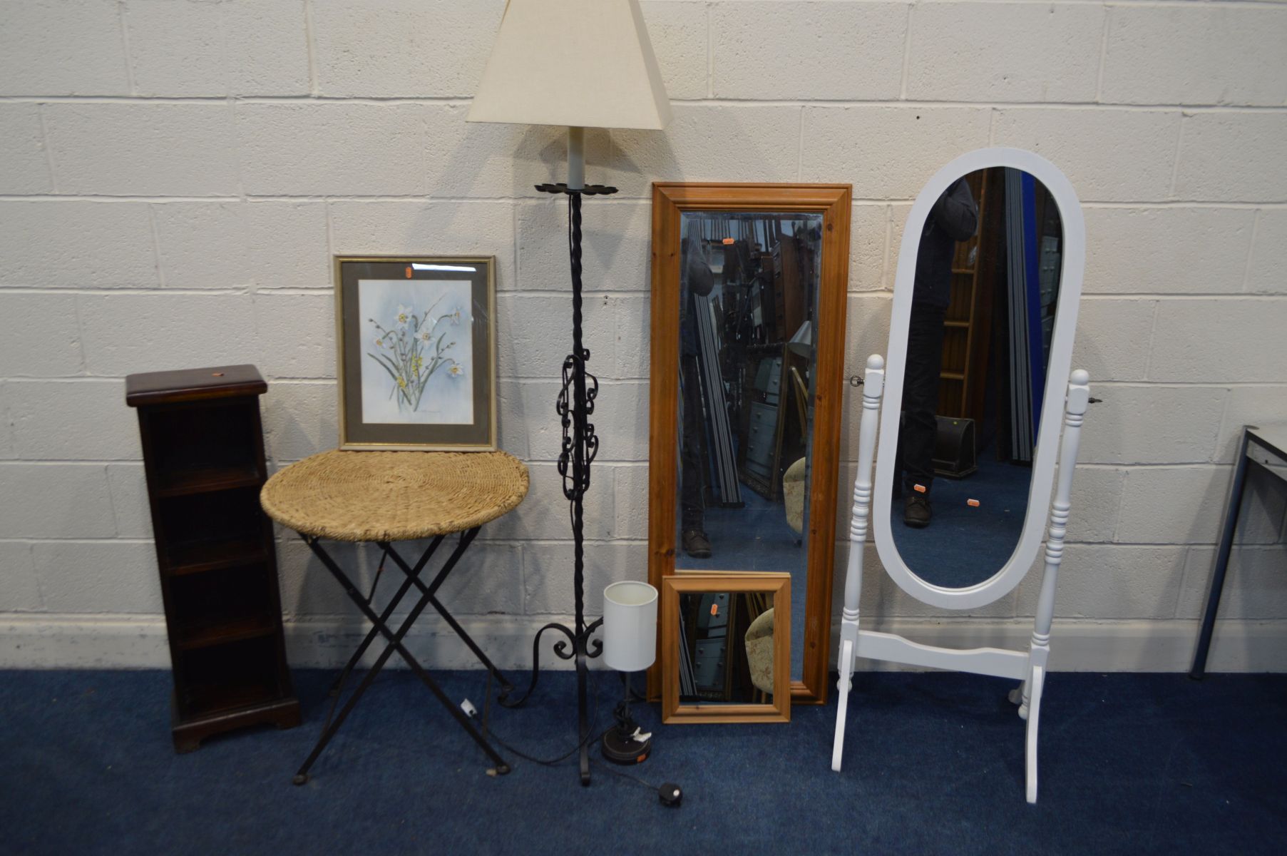A WHITE PAINTED CHEVAL MIRROR, together with a wicker folding table, wrought iron standard lamp,