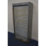 AN INDUSTRIAL METAL TAMBOUR FRONT STORAGE UNIT, with later pine shelves, width 90cm and depth 47cm x