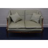 AN EARLY TO MID 20TH CENTURY FRENCH MAHOGANY FRAMED TWO SEATER SOFA, covered in a green