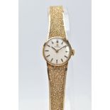 A LADIES 9CT GOLD OMEGA WRISTWATCH, gold tone circular dial signed 'Omega', baton markers, black