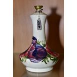 A MOORCROFT POTTERY LAMP BASE , 'Anemone' pattern on green ground, impressed and painted backstamp