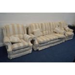 A GOLD AND CREAM STRIPPED THREE PIECE LOUNGE SUITE, comprising a three seater settee, width 210cm,