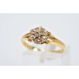 AN EARLY VICTORIAN 18CT GOLD DIAMOND CLUSTER RING, slightly raised cluster set with seven claw