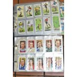 CIGARETTE CARDS, a large collection of 1100-1200 cigarette cards in two albums on a Sporting