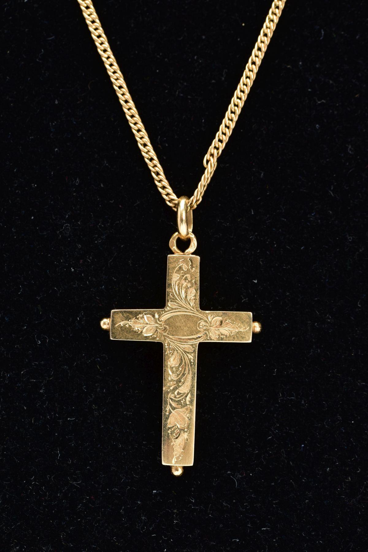 AN 18CT GOLD CRUCIFIX LOCKET AND CHAIN, the foliate and scroll engraved hinged pendant, opens to - Image 2 of 2