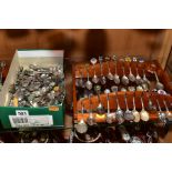 TWO WOODEN DISPLAY SHELVES OF SOUVENIR TEASPOONS, together with a shoebox of loose souvenir