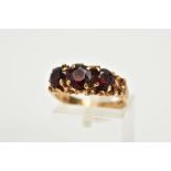 A LATE 20TH CENTURY 9CT GOLD THREE STONE GARNET RING, ring size O, hallmarked 9ct gold,