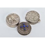 TWO EGYPTIAN SILVER PILL BOXES AND ONE OTHER, the first of circular form, scroll and floral detailed