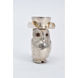 A WHITE METAL OWL VESTA, decorative engraved owl with opening hat lid, set with circular cut