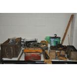 A COLLECTION OF HANDTOOLS including brick laying trowels, wood chisels, corner clamps, bottle jacks,