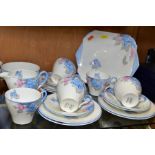 A SHELLEY 'IDEAL CHINA C.R.0708' PART TEA SET, printed and tinted with pink and blue flowers with