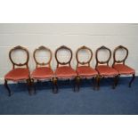 A SET OF SIX WALNUT BALLON BACK CHAIRS, on cabriole front legs