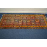 A KAZAK CARPET RUNNER, late 19th century or earlier in multiple colours, 291cm x 115cm (fading in