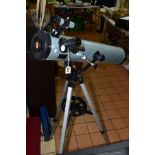 A MODEL 76700 TELESCOPE, diameter 76mm, focal length 700mm, coated lens, mounted on a height