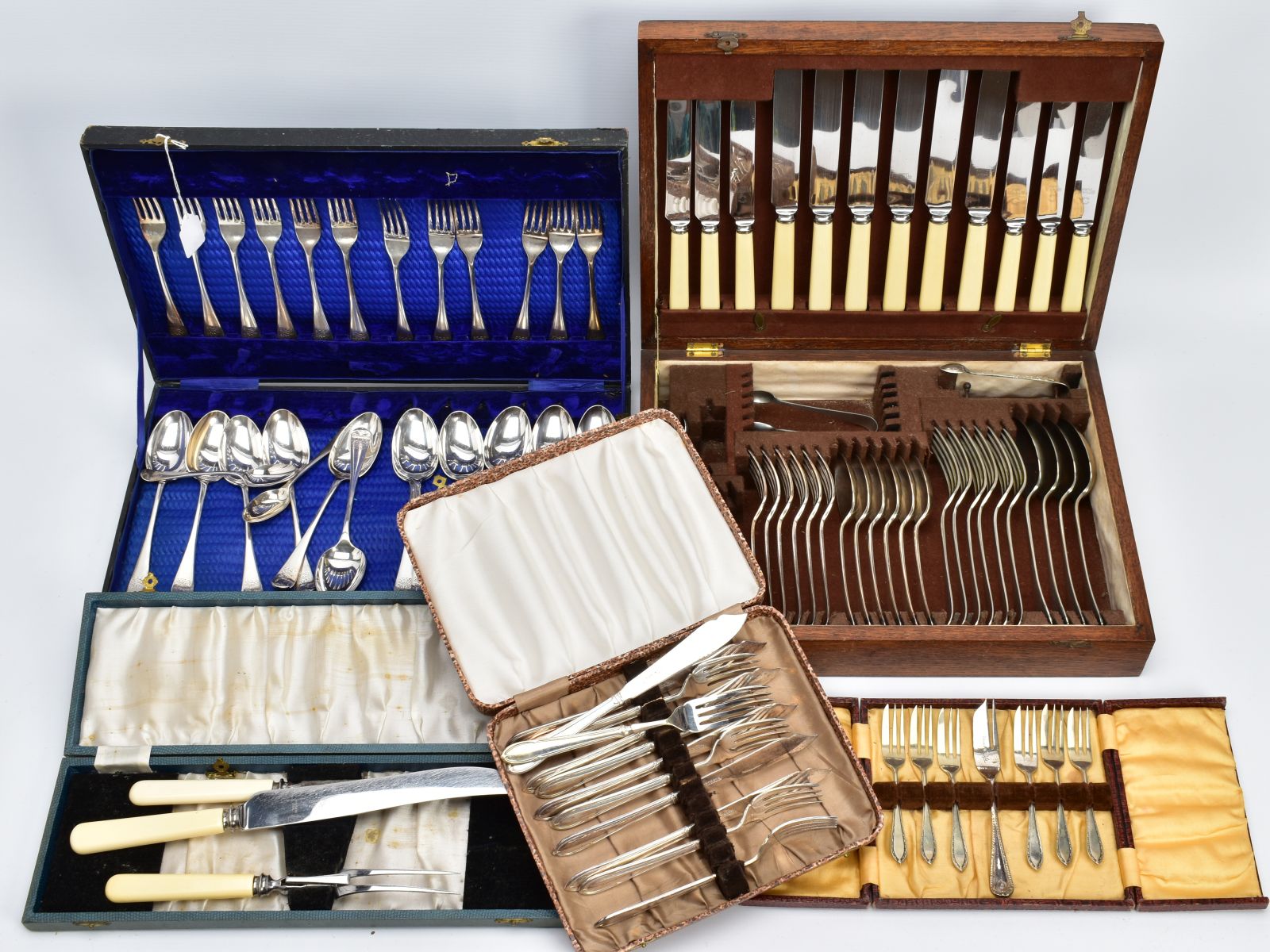 A COLLECTION OF FIVE CASED SILVER PLATED CUTLERY SETS, to include a carving set, a cake set, fish