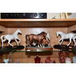 THREE BESWICK WHITE MATT GLAZE HORSE FIGURES, AND A ROYAL DOULTON HORSE AND FOAL ON PLINTH FIGURE,