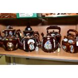 SEVEN LATE VICTORIAN MEASHAM BARGEWARE TEAPOTS, various designs including three of kettle form,