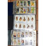 CIGARETTE CARDS, a large collection of 2300-2400 cigarette/trade cards in three albums containing an