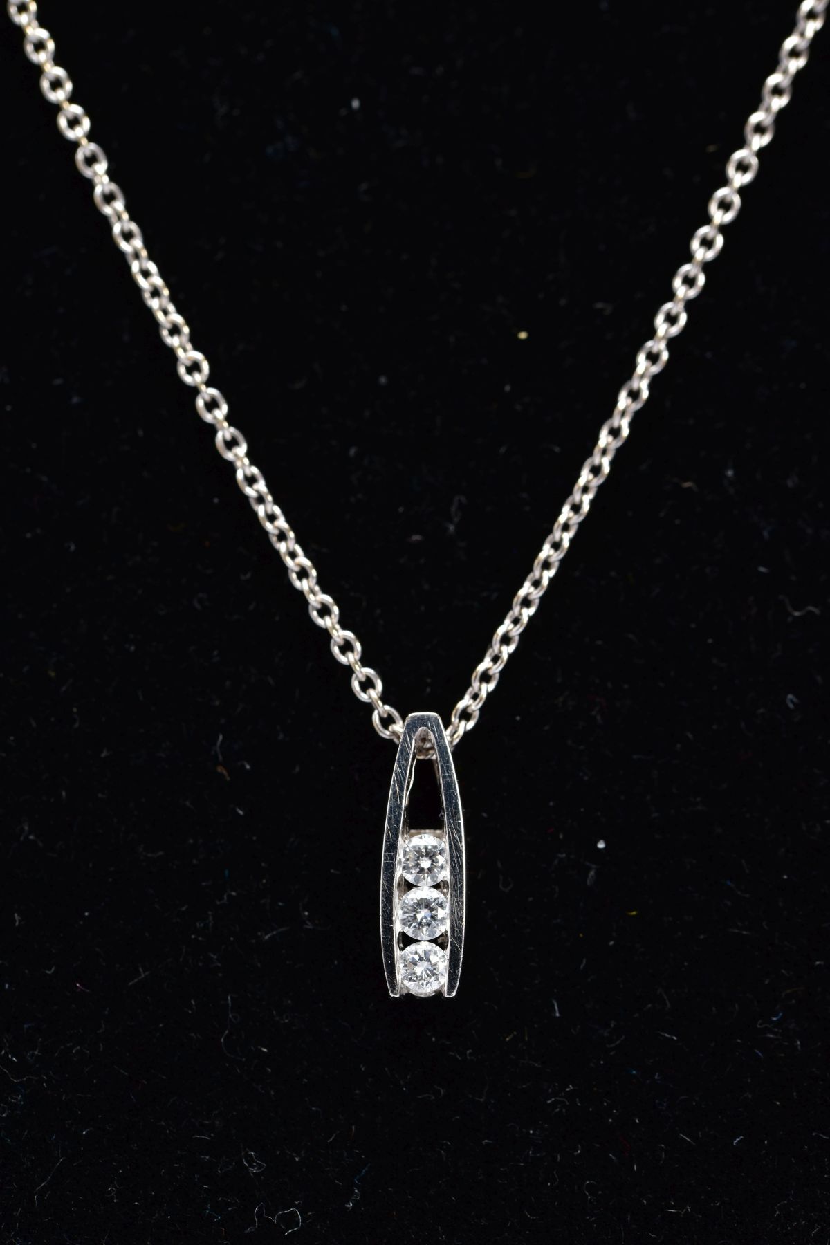 AN 18CT WHITE GOLD DIAMOND PENDANT NECKLACE, the pendant of an openwork drop design, set with