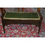 AN EDWARDIAN MAHOGANY DUET PIANO STOOL, with a quantity of sheet music, width 97cm