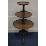 AN EARLY 20TH CENTURY MAHOGANY CIRCULAR GRADUATING THREE TIER DUMB WAITER, in the George III