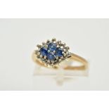 A MODERN 9CT GOLD SAPPHIRE AND DIAMOND CLUSTER RING, four round cut sapphires enclosed within a