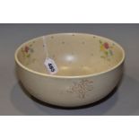 CLARICE CLIFFE BOWL FOR NEWPORT POTTERY, decorated in enamel sprigs of flowers and turquoise dots,