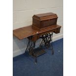 A VINTAGE SINGER TREDLE SEWING MACHINE, with a drop leaf