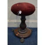 A VICTORIAN MAHOGANY SWIVEL TOP PIANO STOOL, on a fluted tulip support, circular base and triple