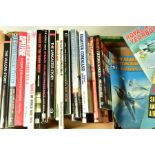 A BOX CONTAINING A LARGE NUMBER OF MILITARY RELATED BOOKS AND MAGAZINES mostly WWII era related,