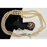 A BLACK VELVET COLLAR NECKLACE WITH A MULTI STRAND IMITATION PEARL NECKLACE, the velvet choker set