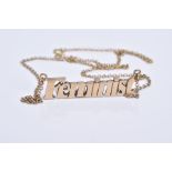 A 9CT GOLD PENDANT, the pendant spelling the word 'Feminist' stamped 9ct, fitted to a fine curb link