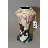 A BLACK RYDEN POTTERY SHOULDERED BALUSTER VASE, painted with a scrolling band of cyclamen flowers,